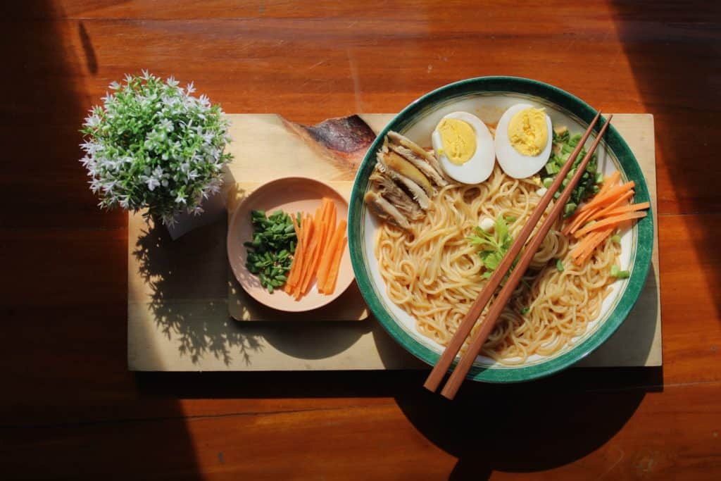 Cooking the basics - noodle dish on white ceramic bowl