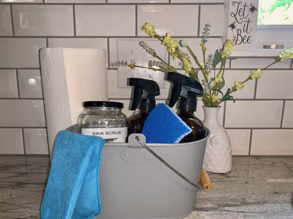 Grey basket of non-toxic cleaning products