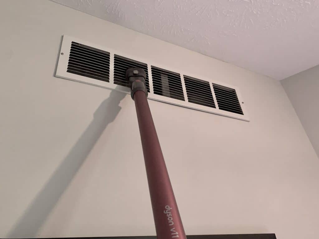 Cleaning air vents with a vacuum