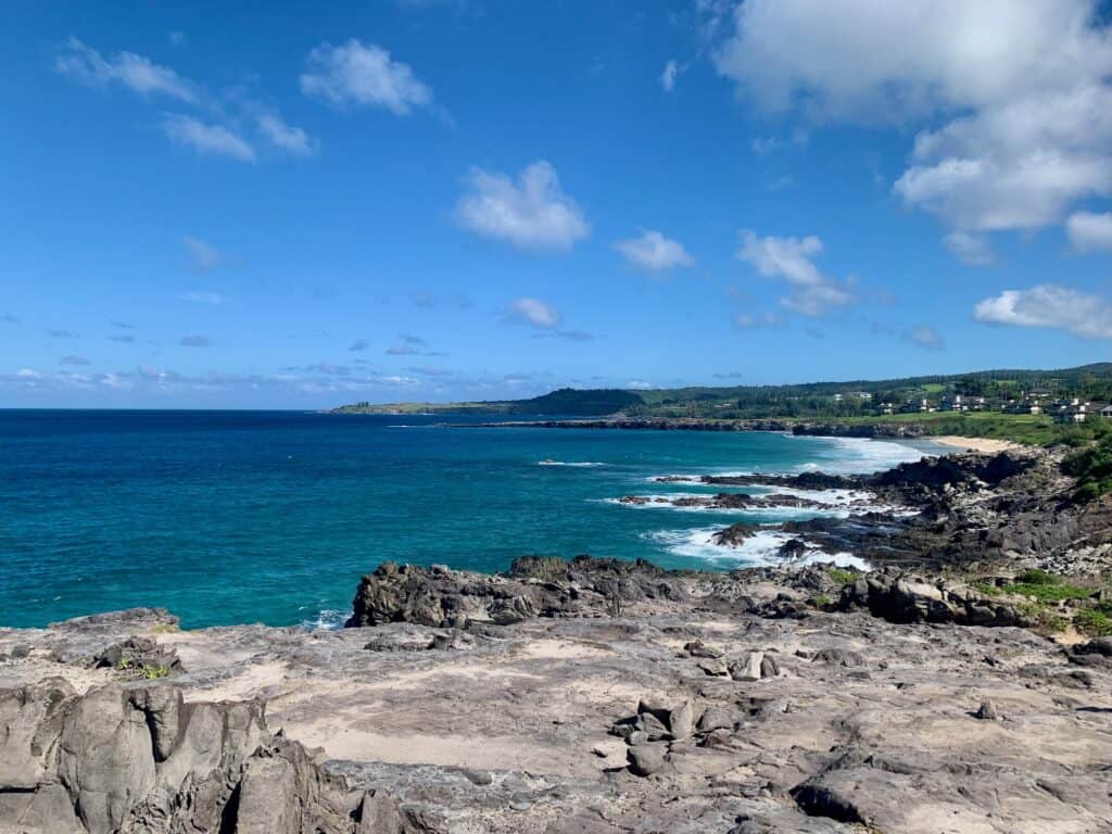 The Maui coastal trail must be added to a perfect Maui travel guide. Beautiful blue ocean and black rocks.