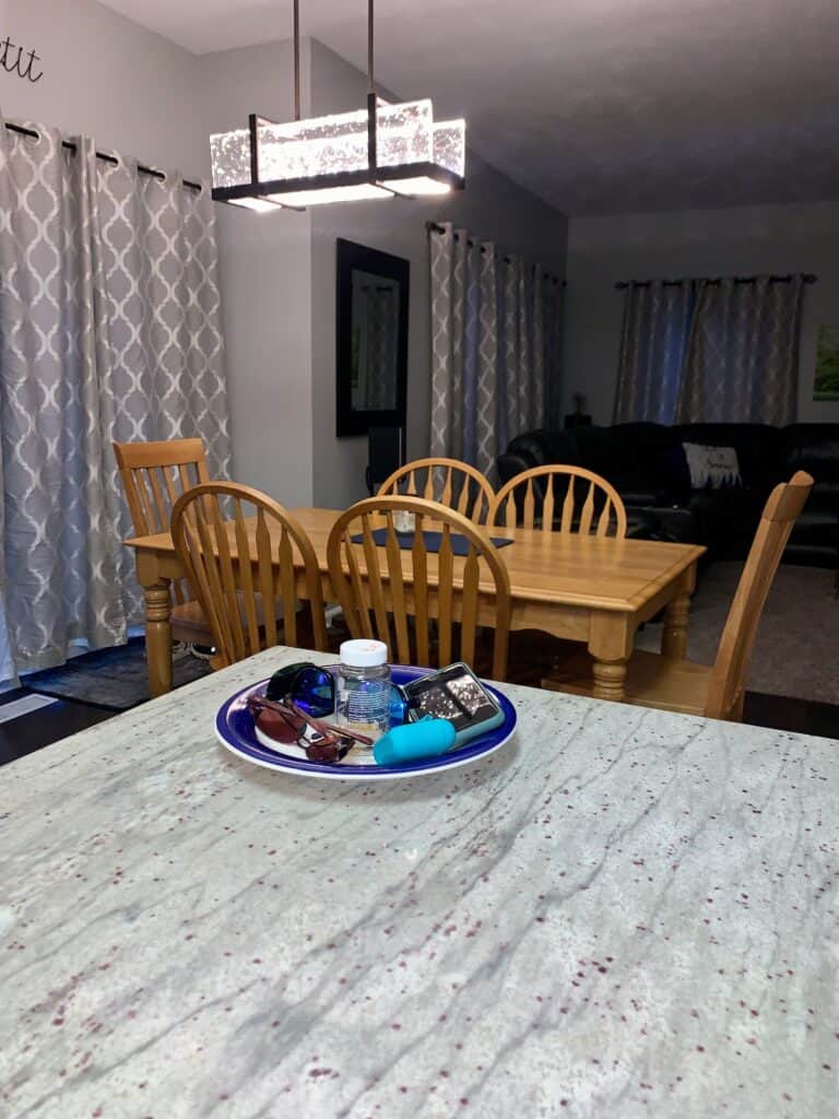 A decorative plate to hold various items on an otherwise clean counter is a great home organization products