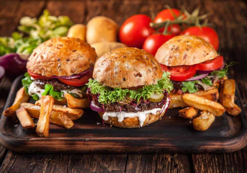 Close-up of homemade burgers and fries