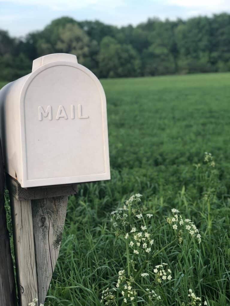 shallow focus photography of gray mailbox. Always stop your mail before going on a trip.