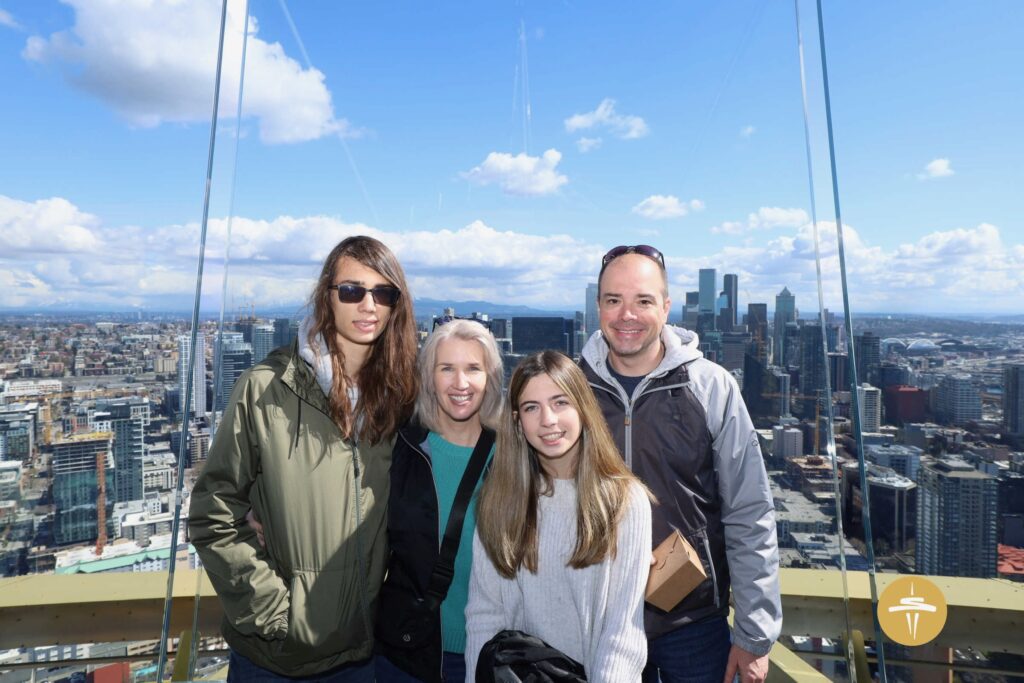A family photo at the top of the Space Needle during a Pacific Northwest trip