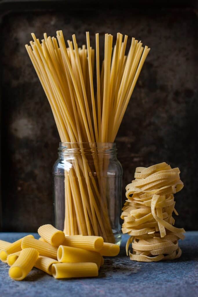 uncooked three pastas are clear pantry staples to have