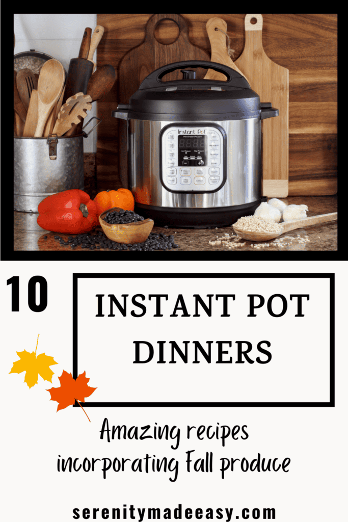 An instant pot with garlic, bell peppers and wooden kitchen tools around it.