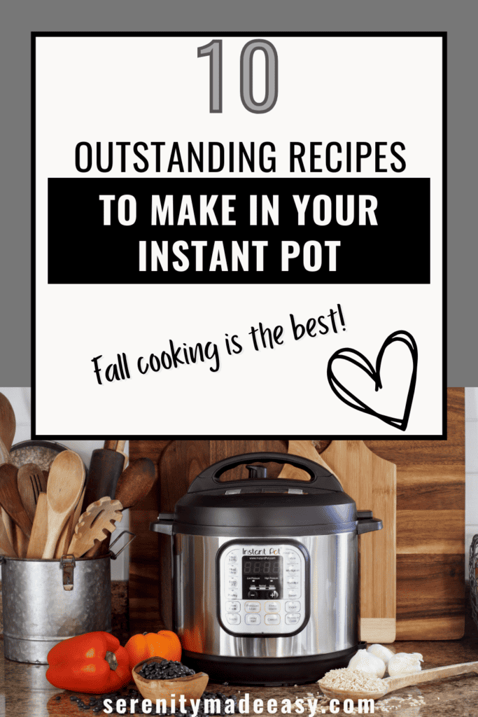 An instant pot with garlic, bell peppers and wooden kitchen tools around it.