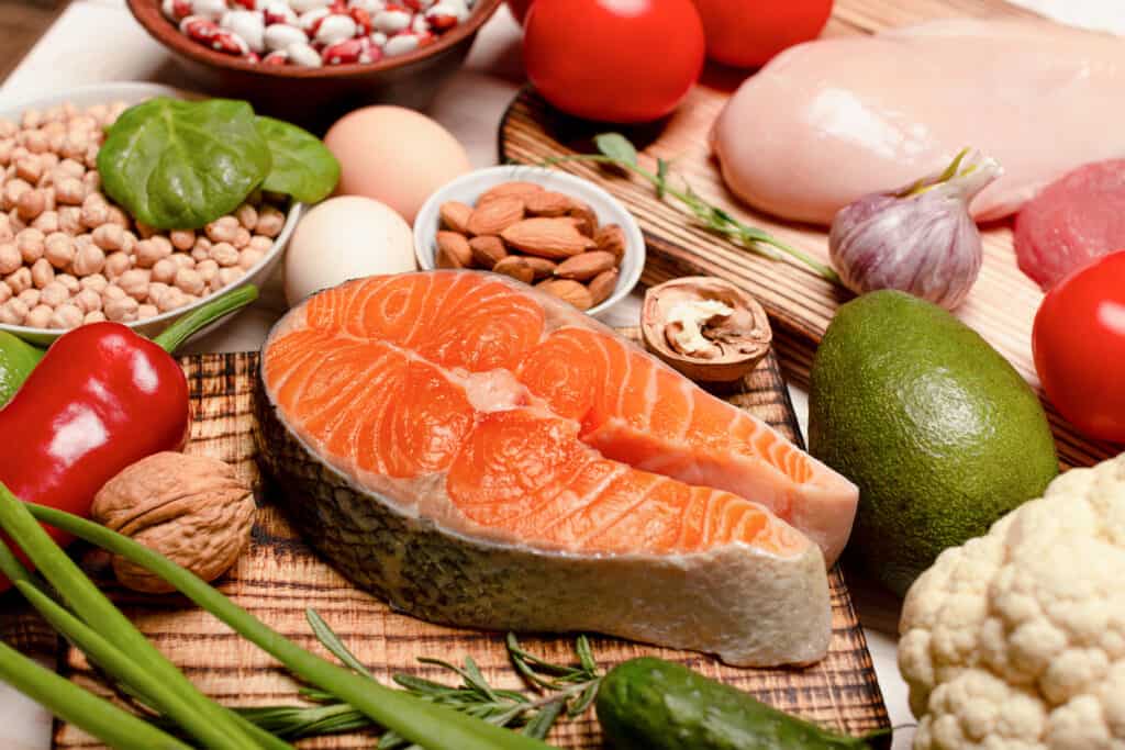 Raw salmon steak and ingredients for cooking close up - foods to lower cortisol