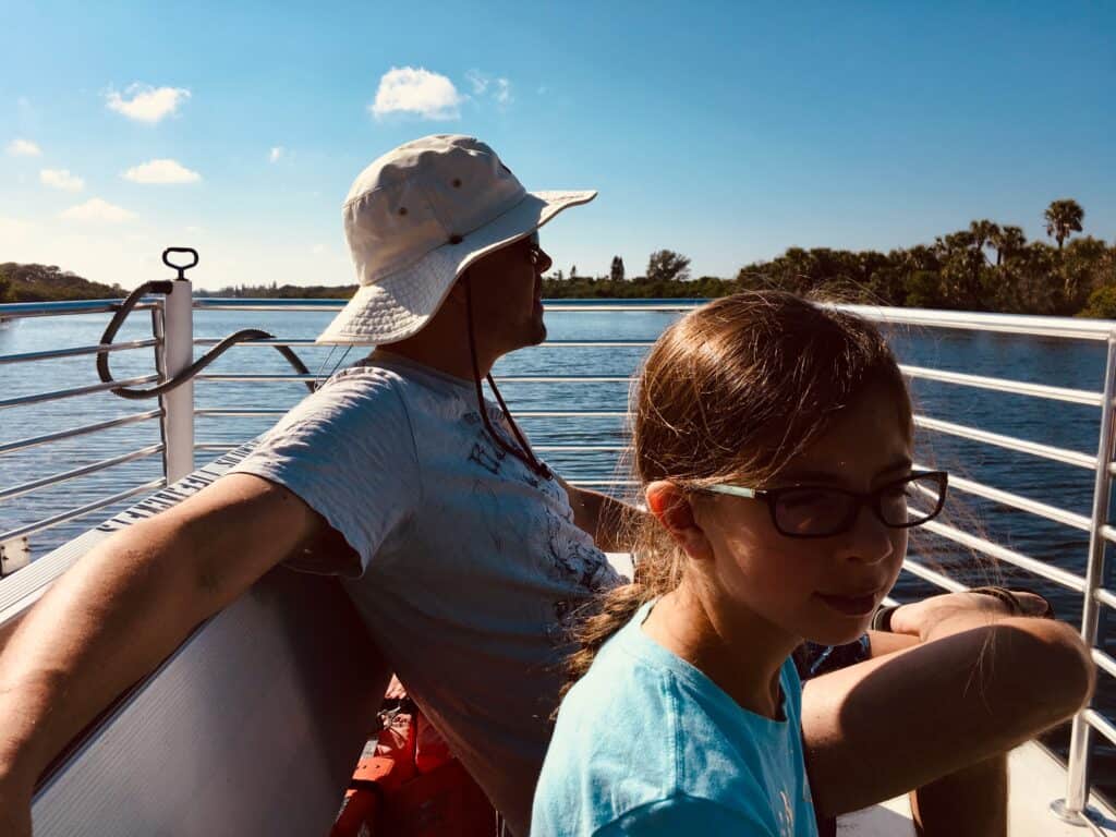 A father and daughter on a ferry boat.