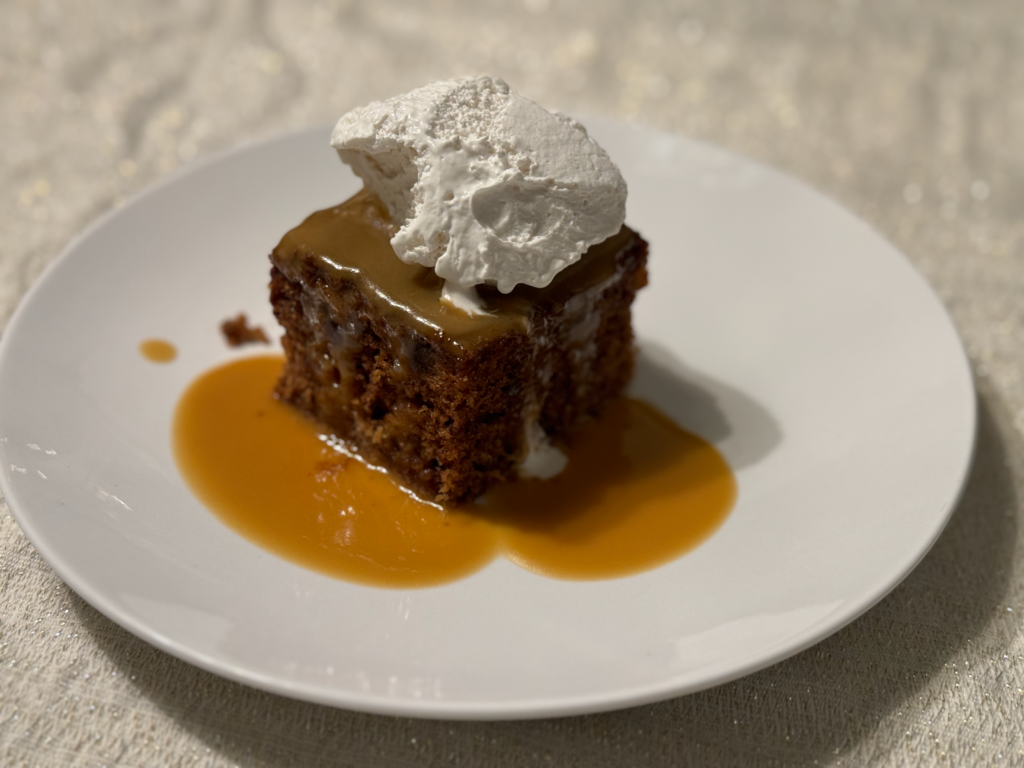 Sticky toffee pudding with whipped cream