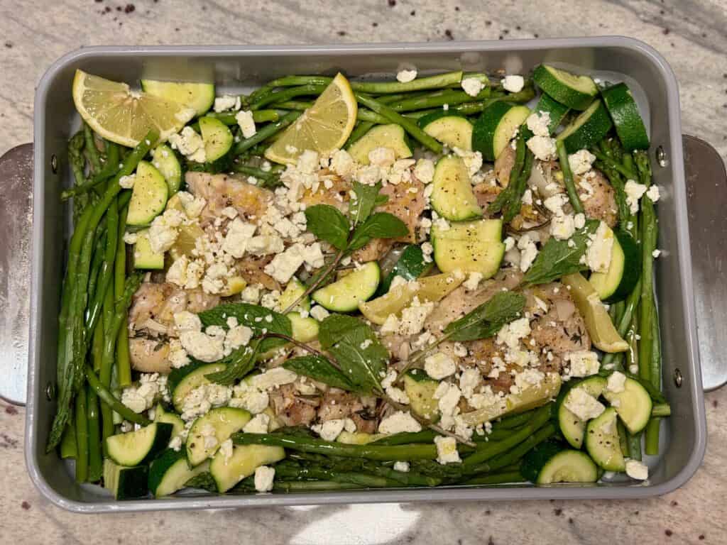 Grilled chicken with fresh herbs, asparagus, zucchini and feta cheese