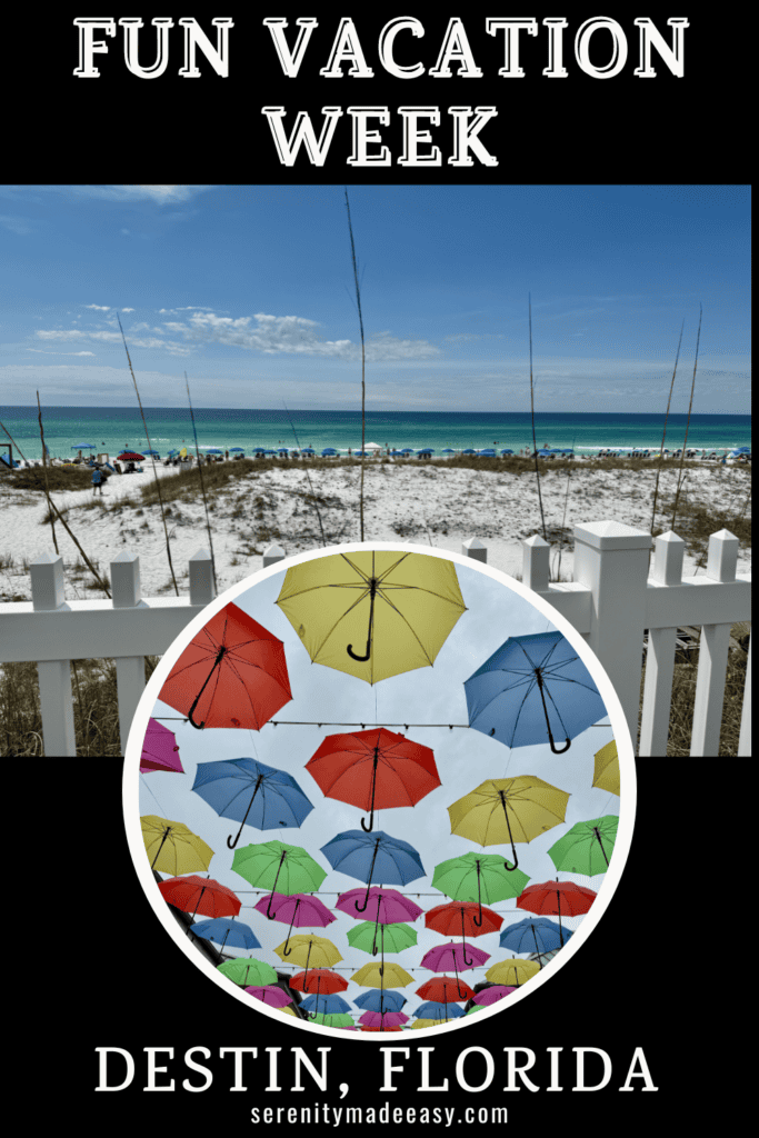 A prestine white sand beach and umbrellas hung over a street in Destin Florida.