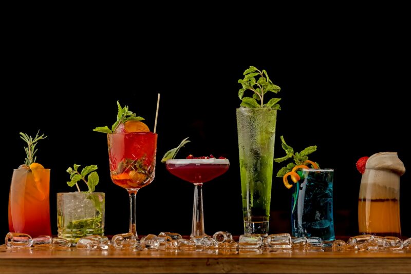 a table topped with lots of different types of non-alcoholic drinks